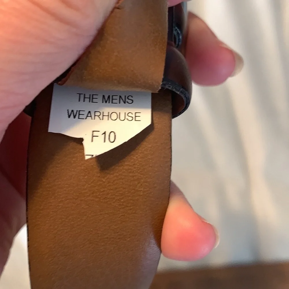 The mens warehouse smooth brown leather belt made in Italy size 38 thin dressy